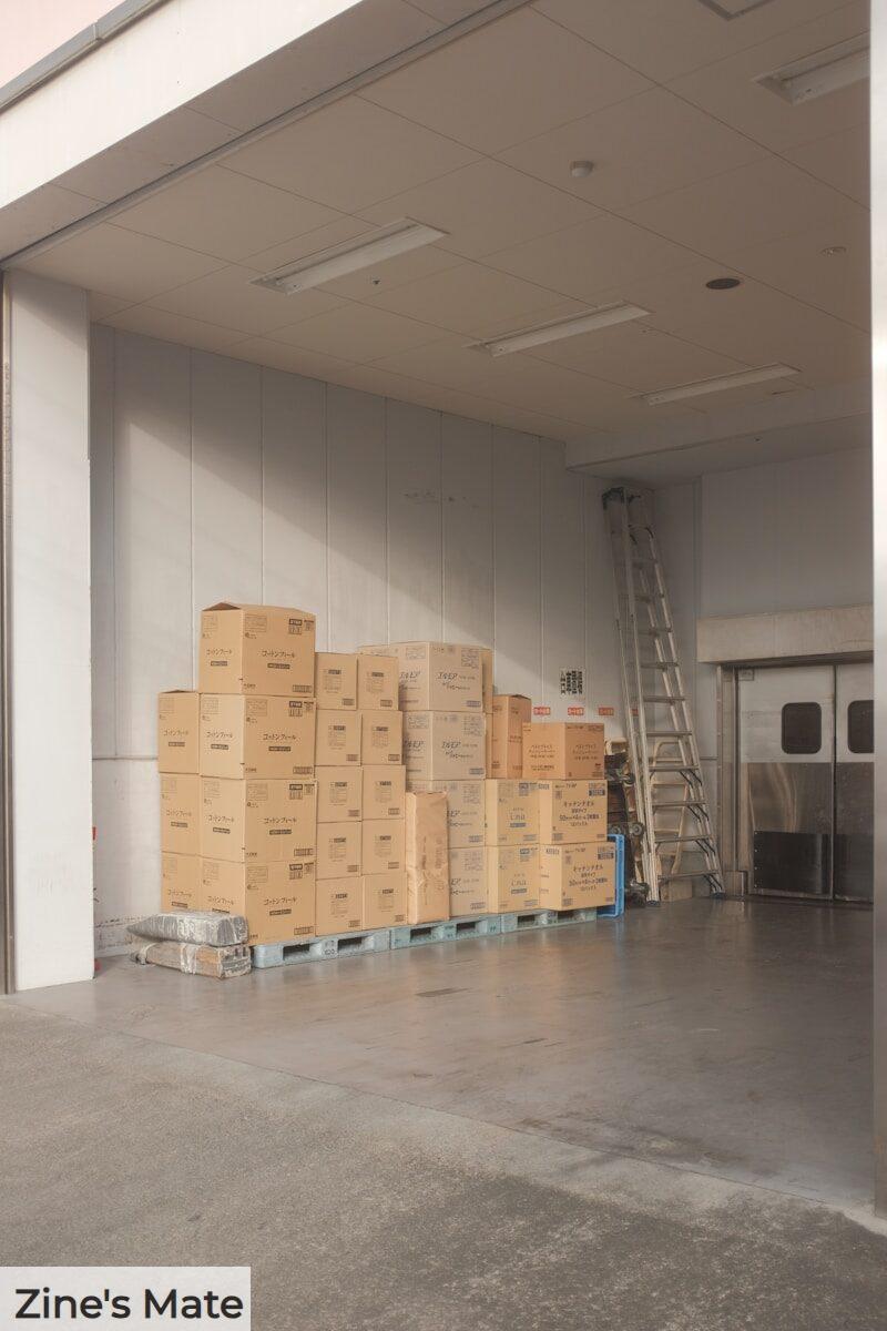 brown cardboard boxes on white floor tiles